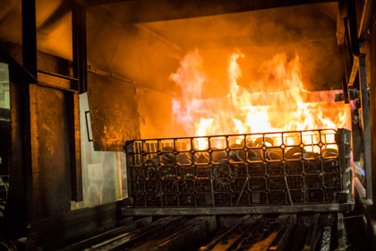 Metal Hardening Services in Plymouth, MI | RMT Woodworth - heated-parts-coming-out-of-the-furnace