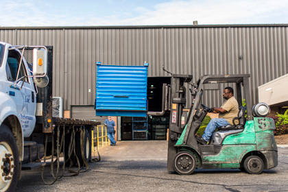 Steel Normalizing Heat Treatment Services in Plymouth, MI | RMT Woodworth - worker-unloading-a-truck